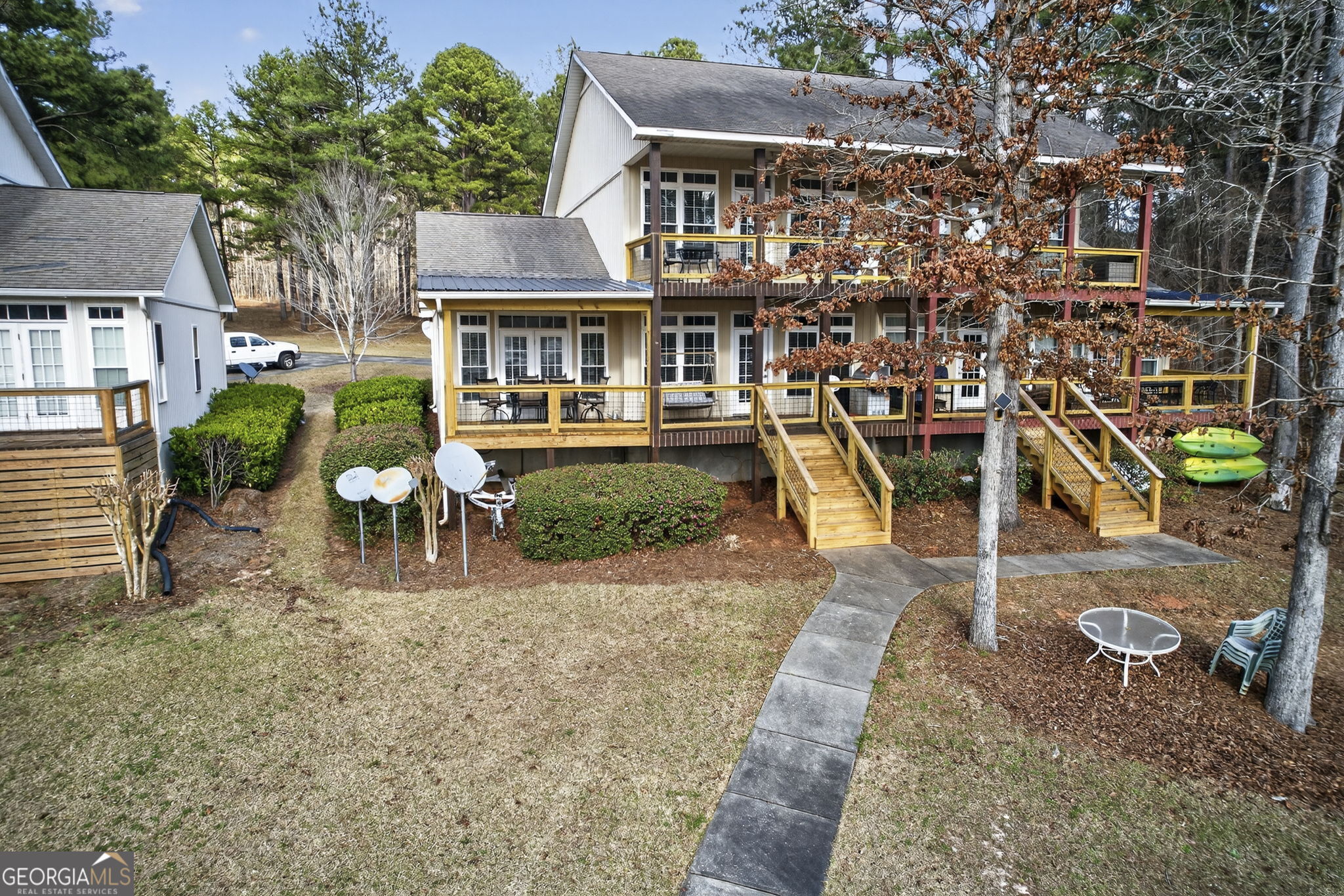 655 Sandy Run Drive, Unit 4 Sparta, GA 31087 - Photo 18 of 59 an aerial view of a house with a yard table and chairs