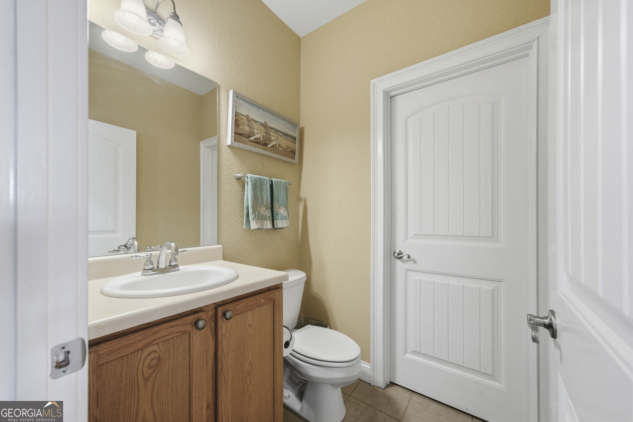 655 Sandy Run Drive, Unit 4 Sparta, GA 31087 - Photo 25 of 59 a bathroom with a toilet sink and mirror