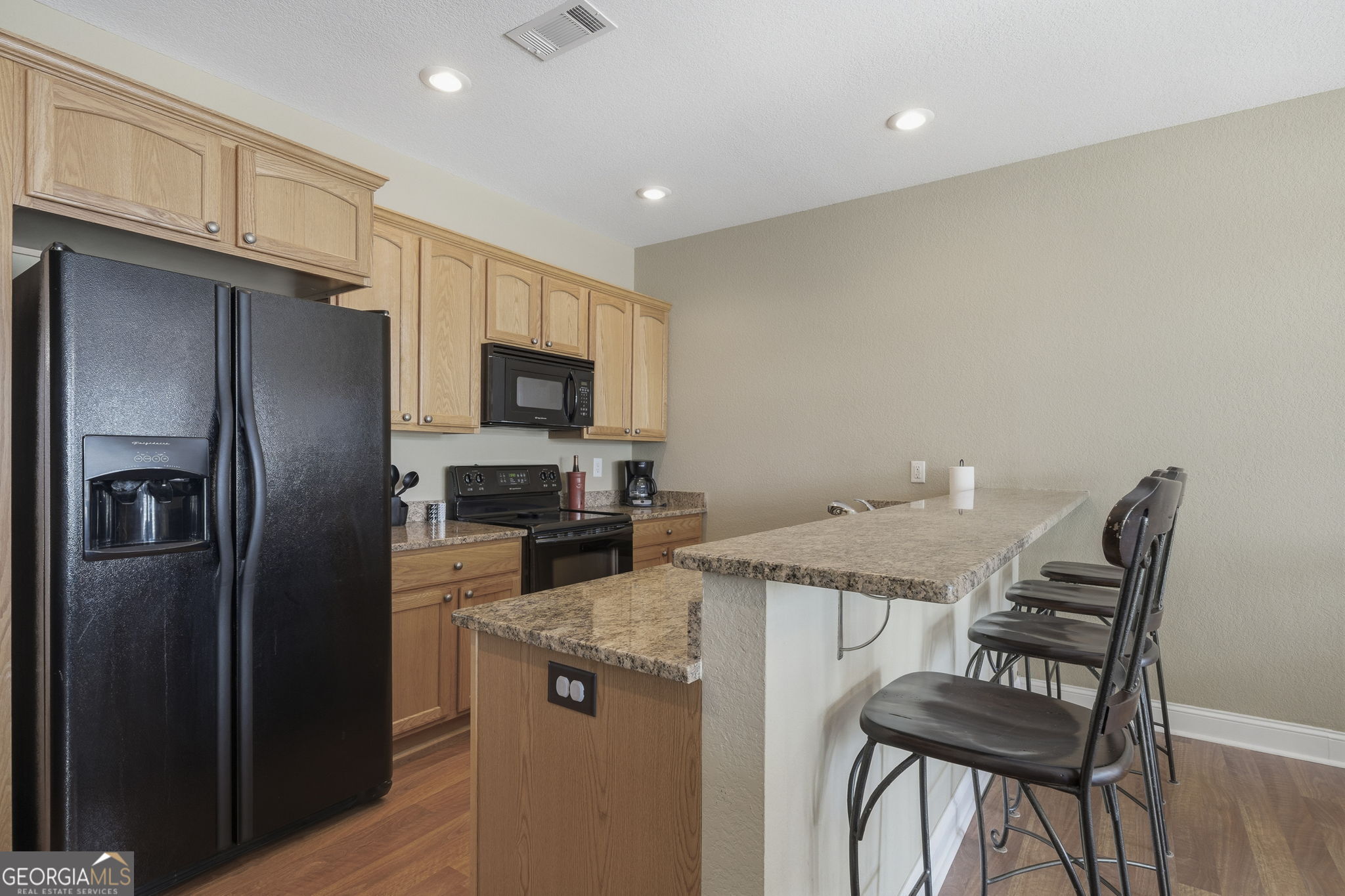 655 Sandy Run Drive, Unit 4 Sparta, GA 31087 - Photo 28 of 59 a kitchen with cabinets and stainless steel appliances