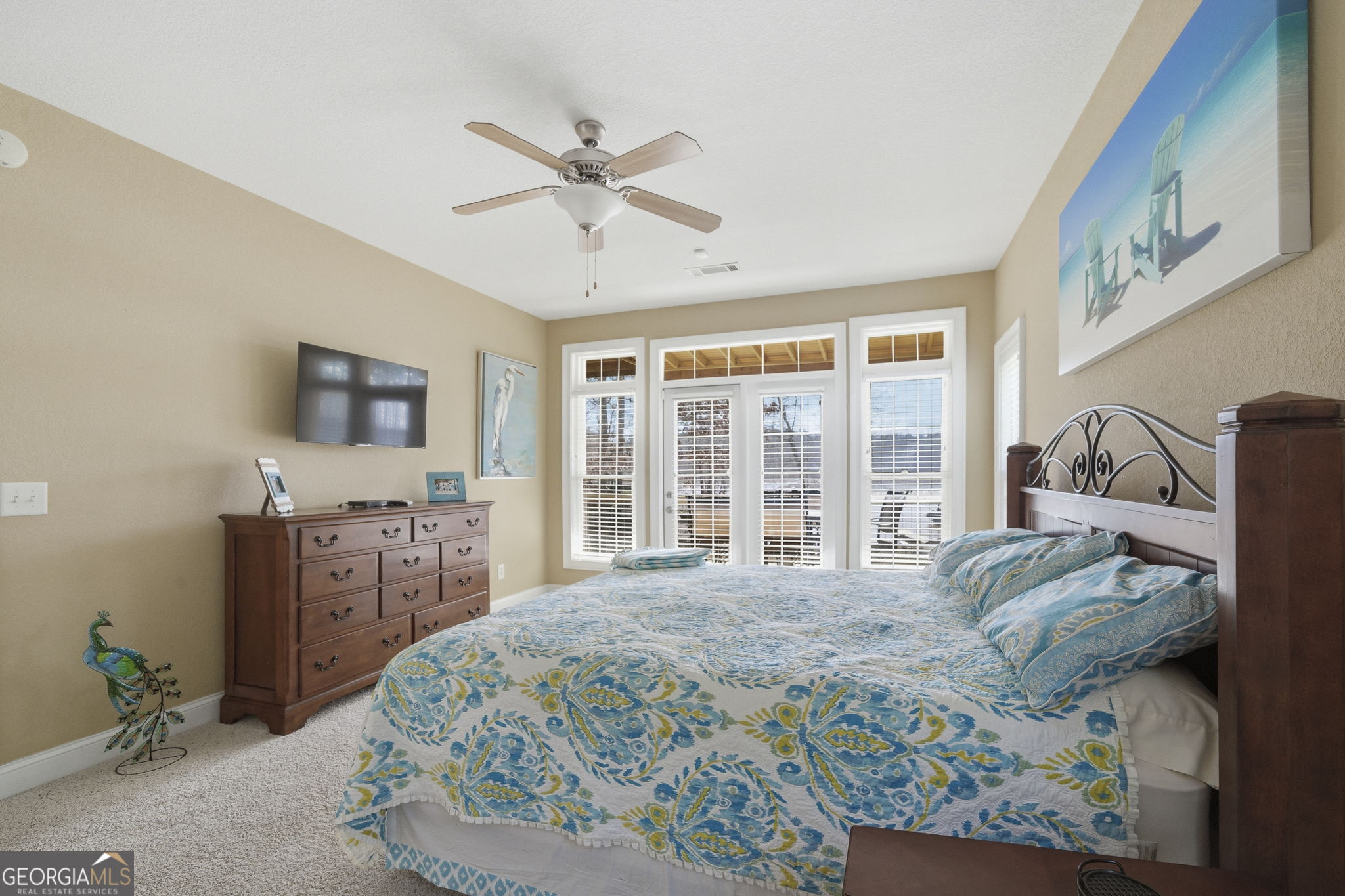 655 Sandy Run Drive, Unit 4 Sparta, GA 31087 - Photo 39 of 59 a living room with a bed furniture and a flat screen tv