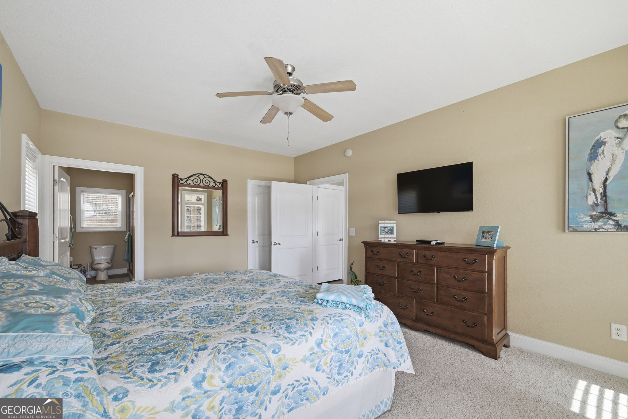 655 Sandy Run Drive, Unit 4 Sparta, GA 31087 - Photo 40 of 59 a bedroom with a bed and a flat screen tv