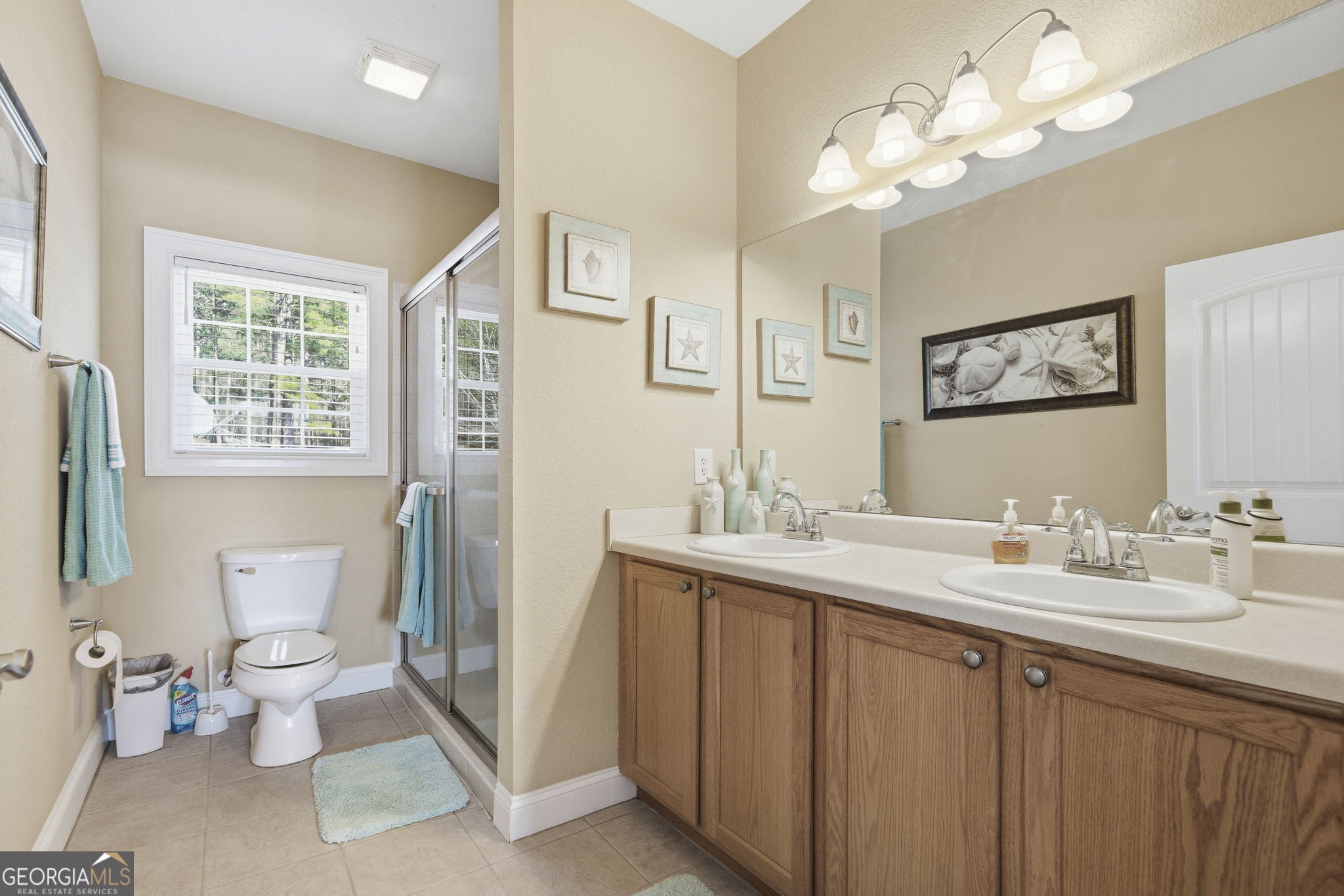 655 Sandy Run Drive, Unit 4 Sparta, GA 31087 - Photo 41 of 59 a spacious bathroom with a double vanity sink mirror and toilet