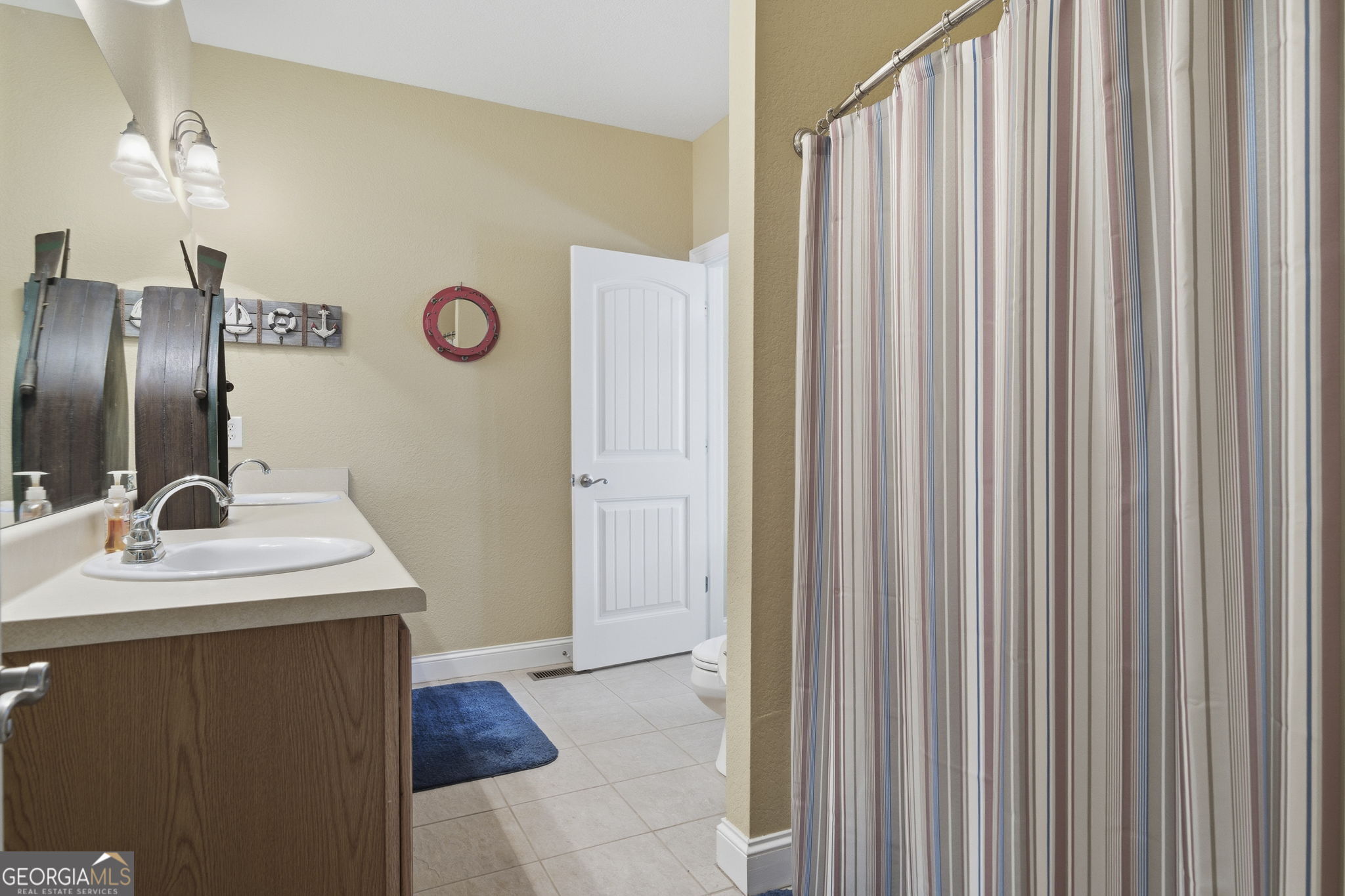 655 Sandy Run Drive, Unit 4 Sparta, GA 31087 - Photo 47 of 59 a bathroom with a sink and a mirror