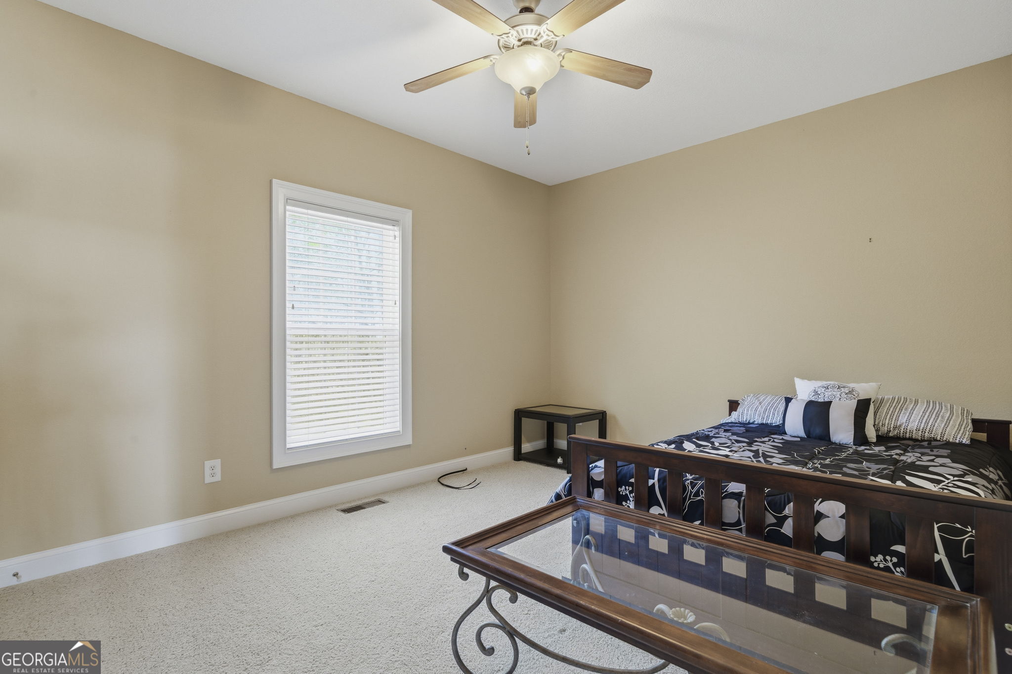 655 Sandy Run Drive, Unit 4 Sparta, GA 31087 - Photo 48 of 59 a living room with a piano and a window