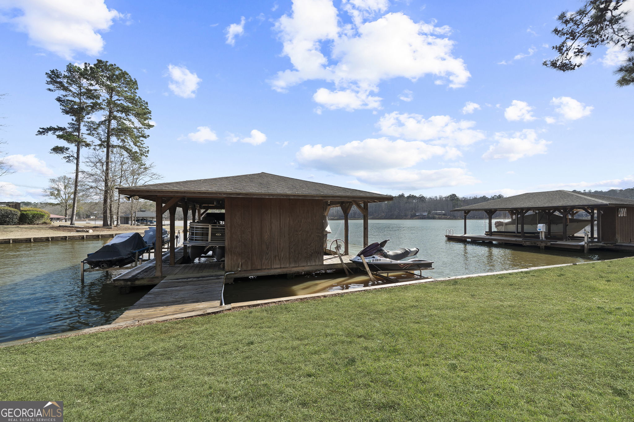 655 Sandy Run Drive, Unit 4 Sparta, GA 31087 - Photo 55 of 59 a view of a swimming pool and lounge chairs in patio