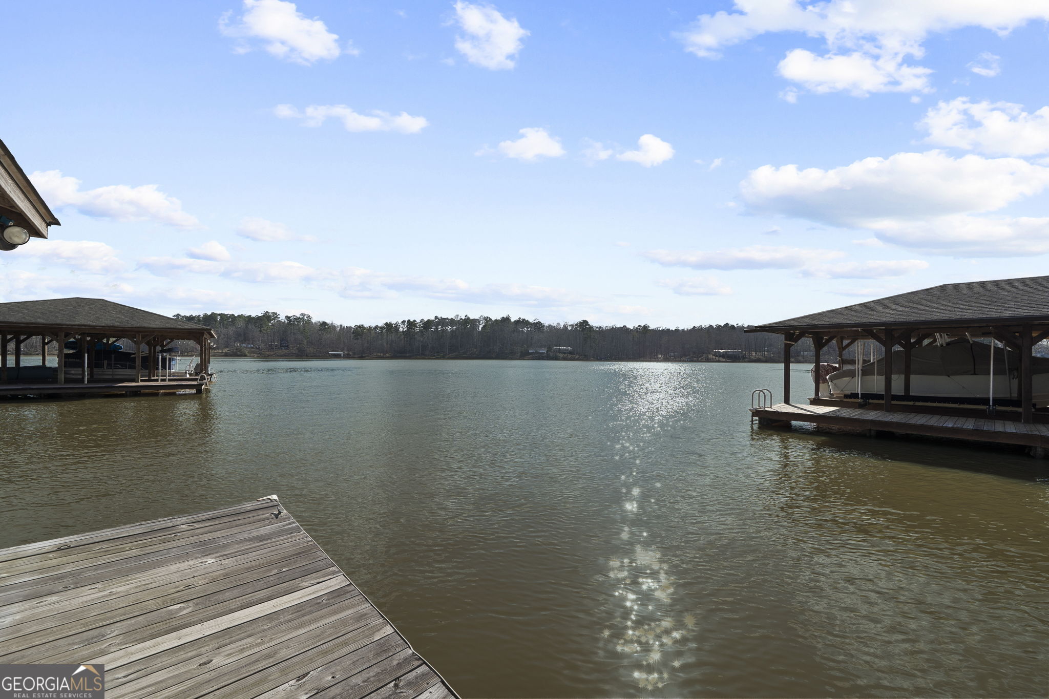 655 Sandy Run Drive, Unit 4 Sparta, GA 31087 - Photo 56 of 59 a view of a lake with outdoor space
