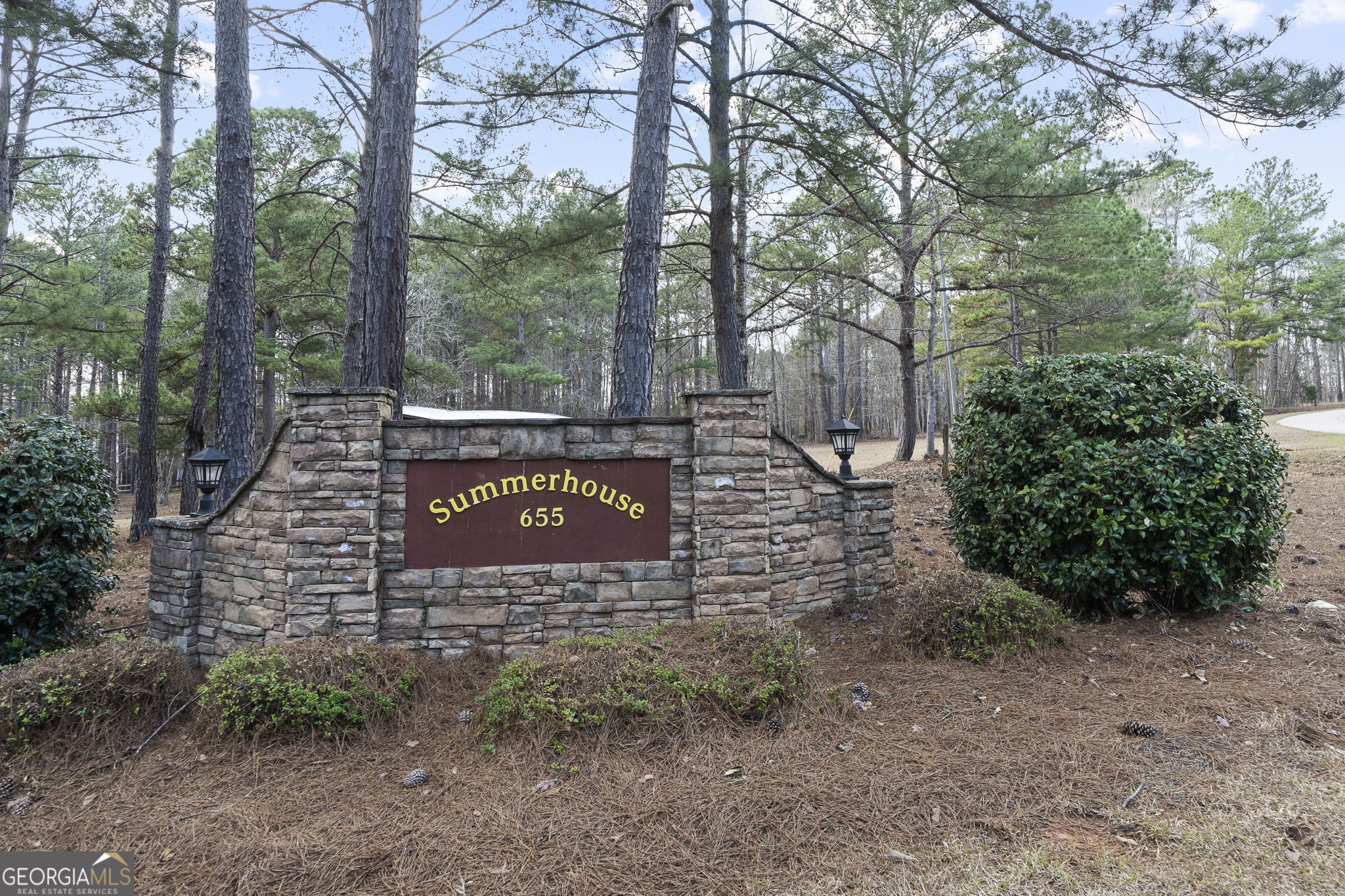 655 Sandy Run Drive, Unit 4 Sparta, GA 31087 - Photo 58 of 59 a sign board with tall trees