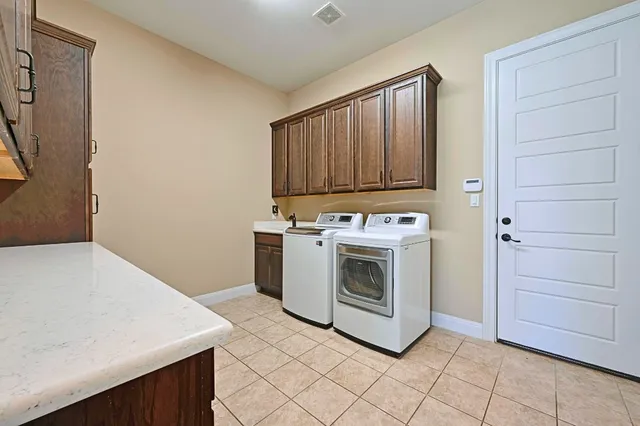 a kitchen with stainless steel appliances kitchen island granite countertop a sink and cabinets