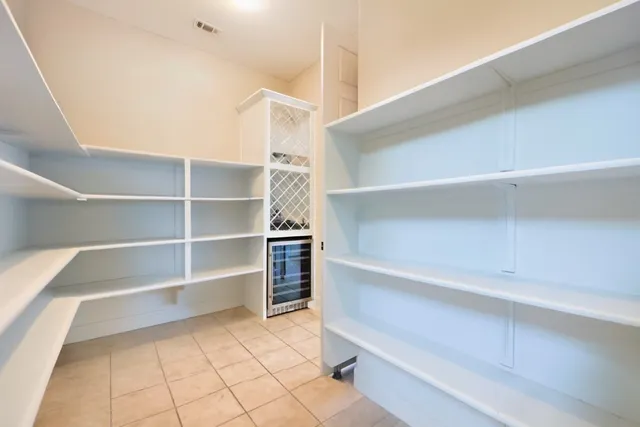 a view of kitchen and cabinets