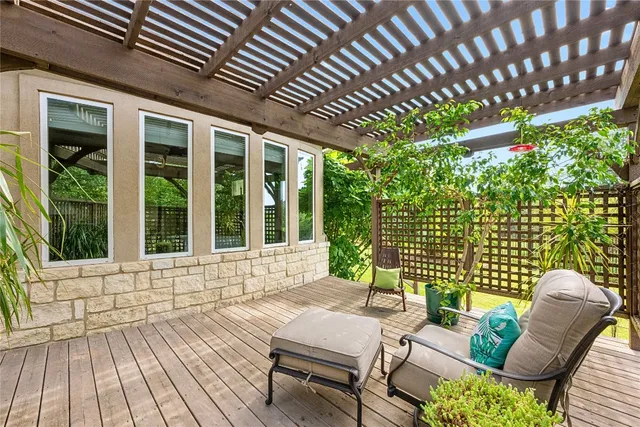 a view of a chairs and table in the patio