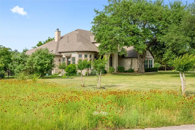 a view of a patio with couches table and chairs and potted plants