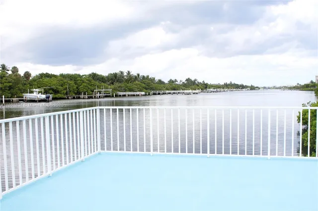 a view of a swimming pool with a lounge chair