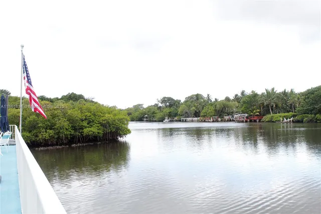 a view of a terrace with wooden floor and lake view