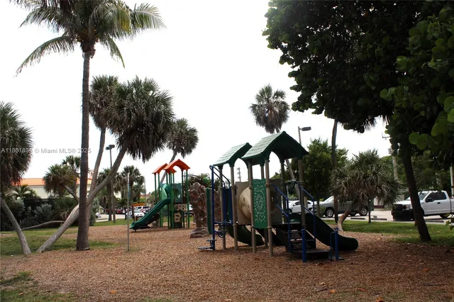 a view of house with a yard and ocean view