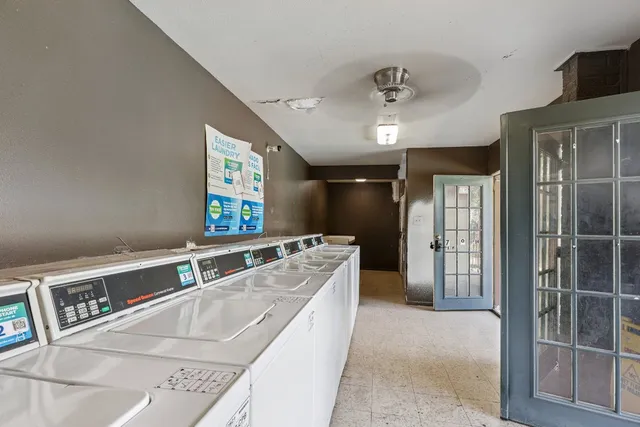 a spacious bathroom with a bathtub and a shower