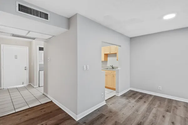 a view of kitchen and wooden floor