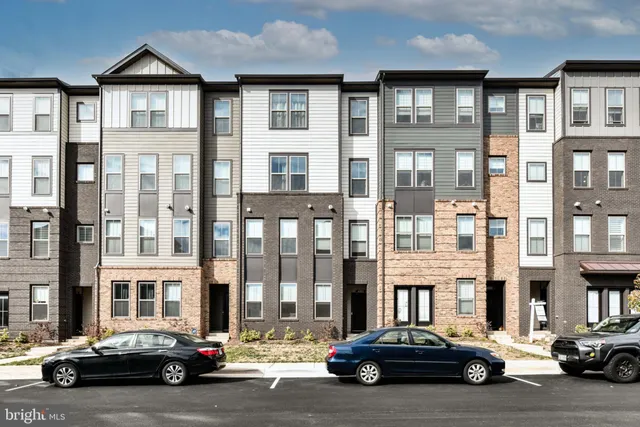 a car parked in front of a brick building