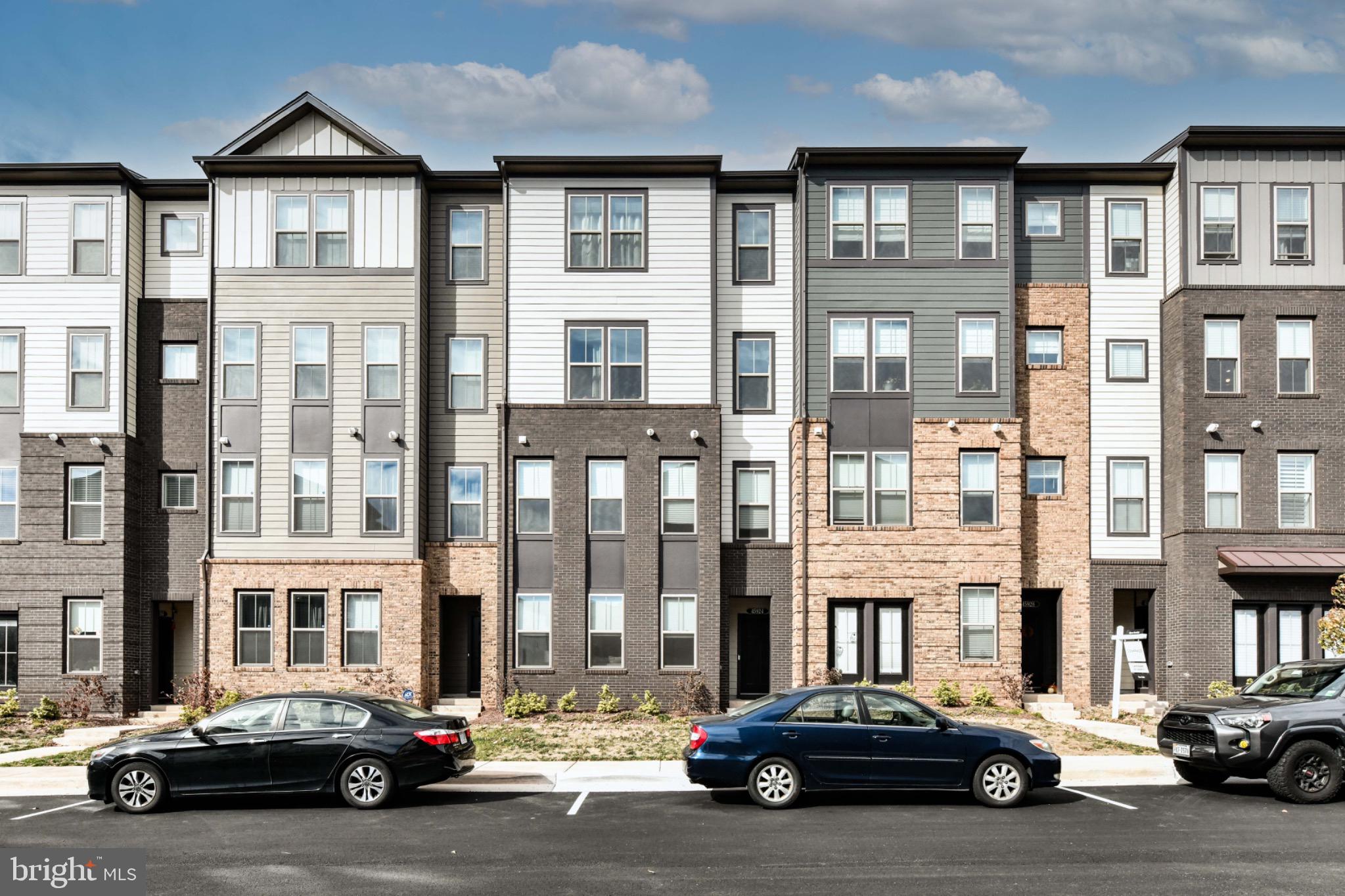a car parked in front of a brick building