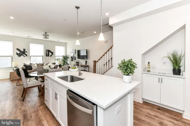 a kitchen with a sink and stove