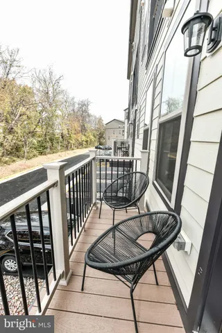 a view of balcony with furniture