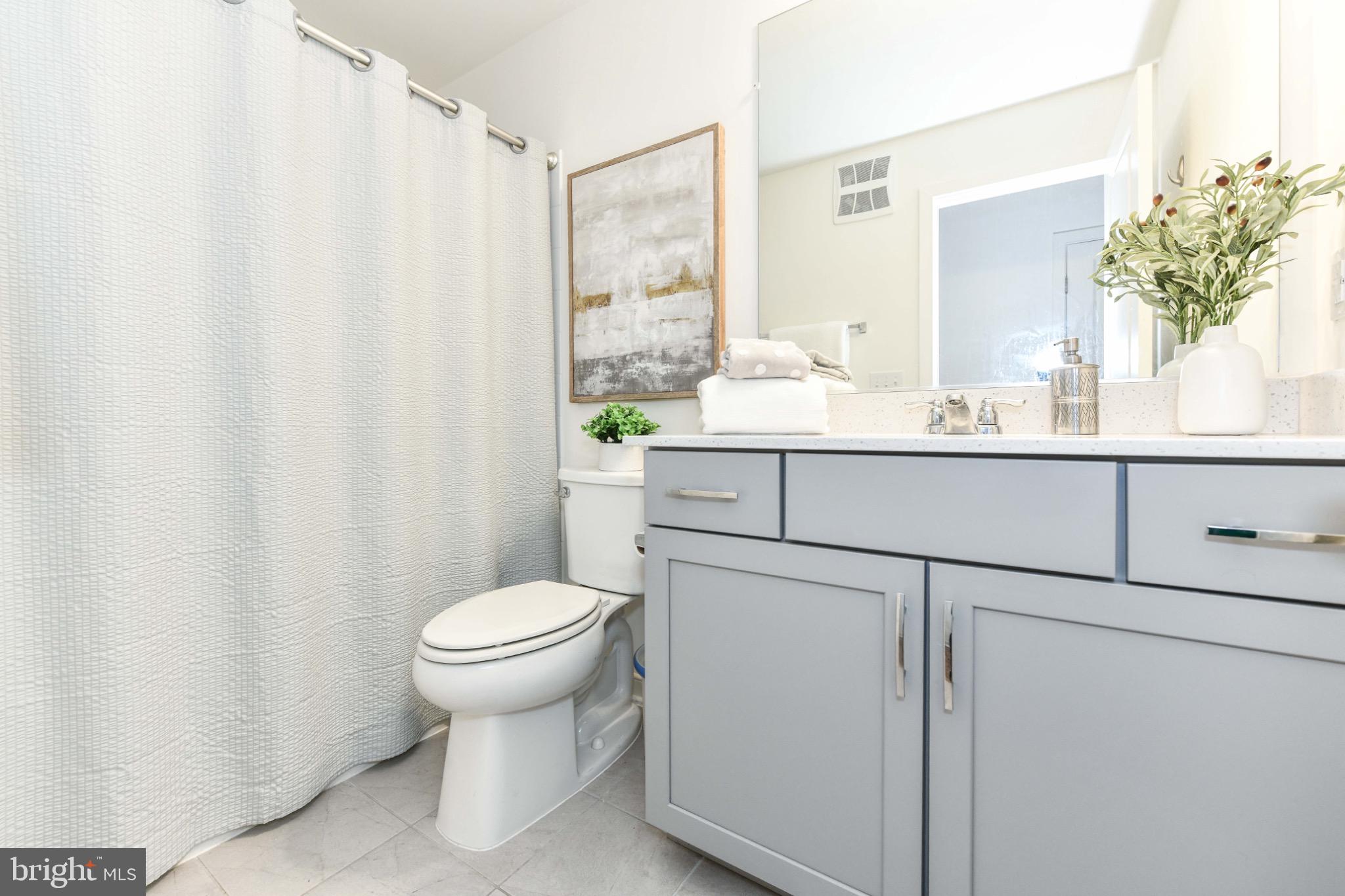 45922 Swallow Terrace Sterling, VA 20165 - Photo 26 of 36 a bathroom with a sink toilet and shower