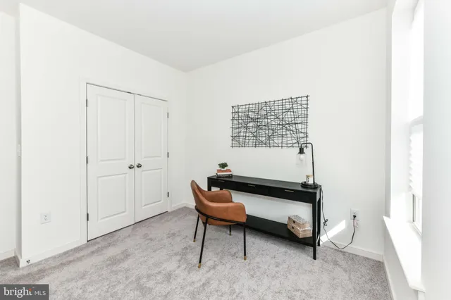 a reading room with furniture and a window