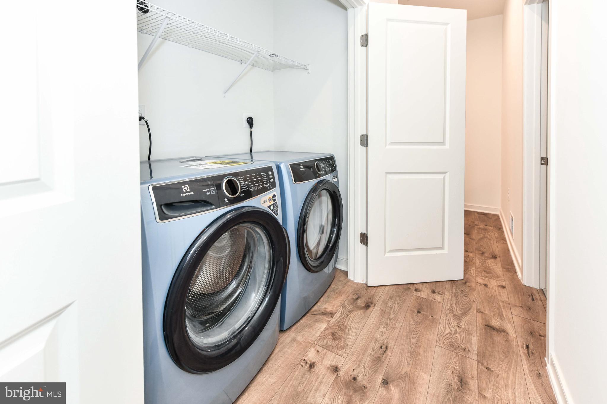 45922 Swallow Terrace Sterling, VA 20165 - Photo 30 of 36 a view of storage and utility room with washer and dryer