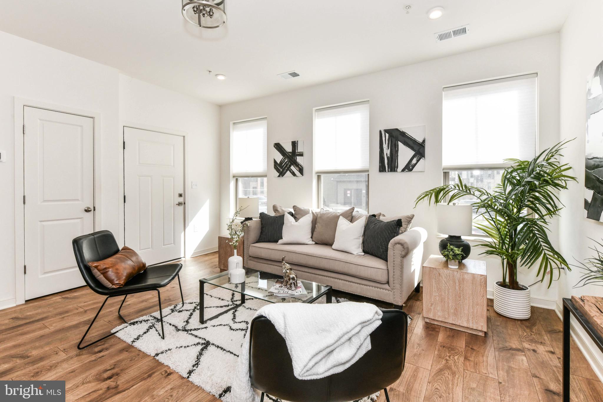 45922 Swallow Terrace Sterling, VA 20165 - Photo 7 of 36 a living room with furniture and a potted plant