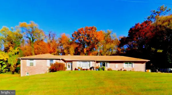 a view of a house with a big yard