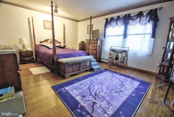 a living room with furniture rug and a large window