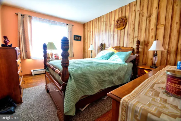 a bed room with a bed and a chair