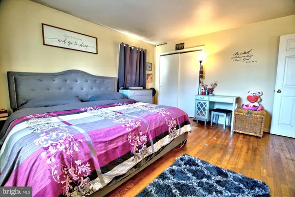 a bed room with a bed and a chair