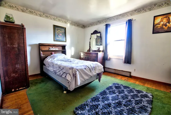 a bedroom with bed and a window