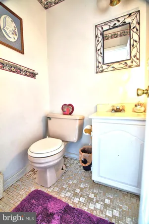 a bathroom with a toilet and a shower curtain