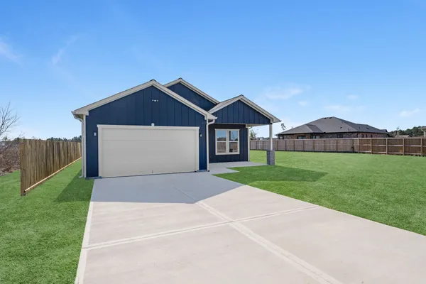 a front view of a house with yard