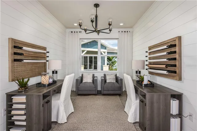 a view of a dining room with furniture and window