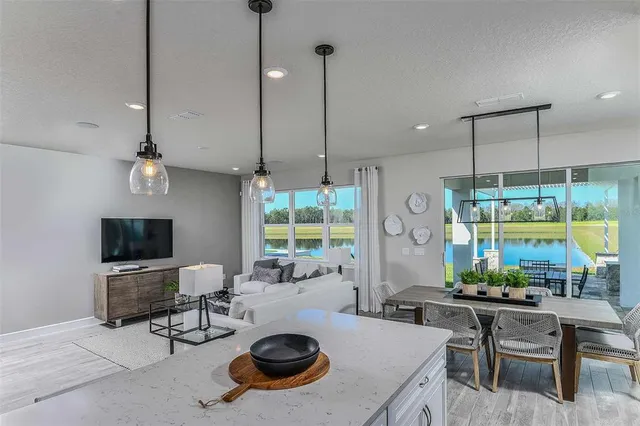 a kitchen with a stove a table and chairs