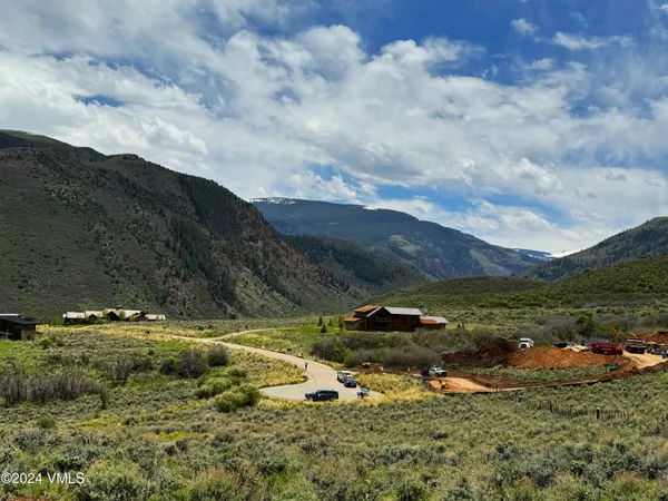 a view of a town with mountains in the background