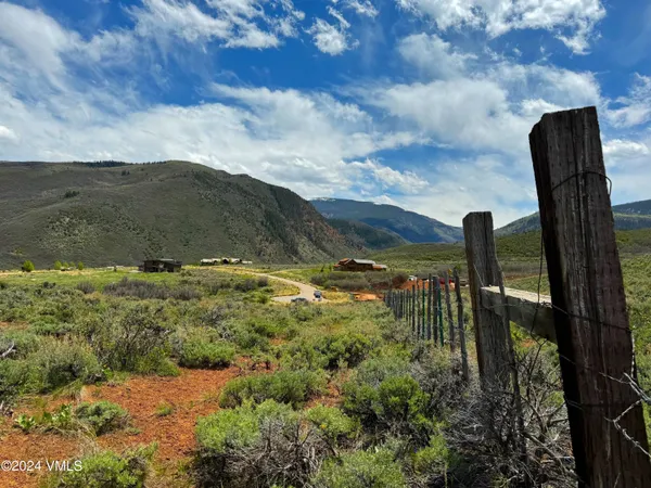 a view of a yard with an outdoor seating