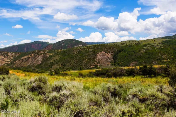 a view of ocean with mountains