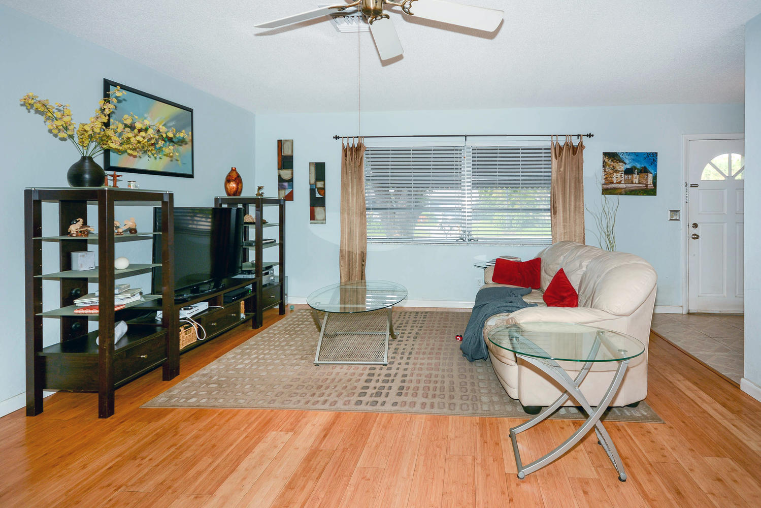 493 Dover Road Tequesta, FL 33469 - Photo 13 of 33 a living room with furniture a flat screen tv and a dining table