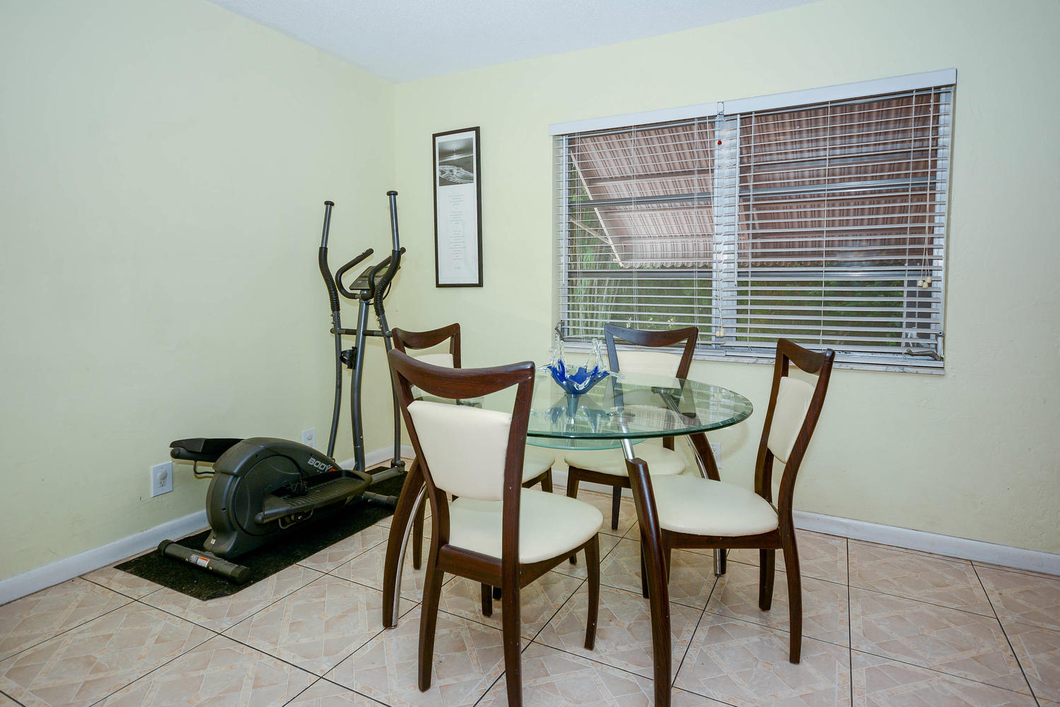 493 Dover Road Tequesta, FL 33469 - Photo 21 of 33 a view of a room that has a bench and a chair