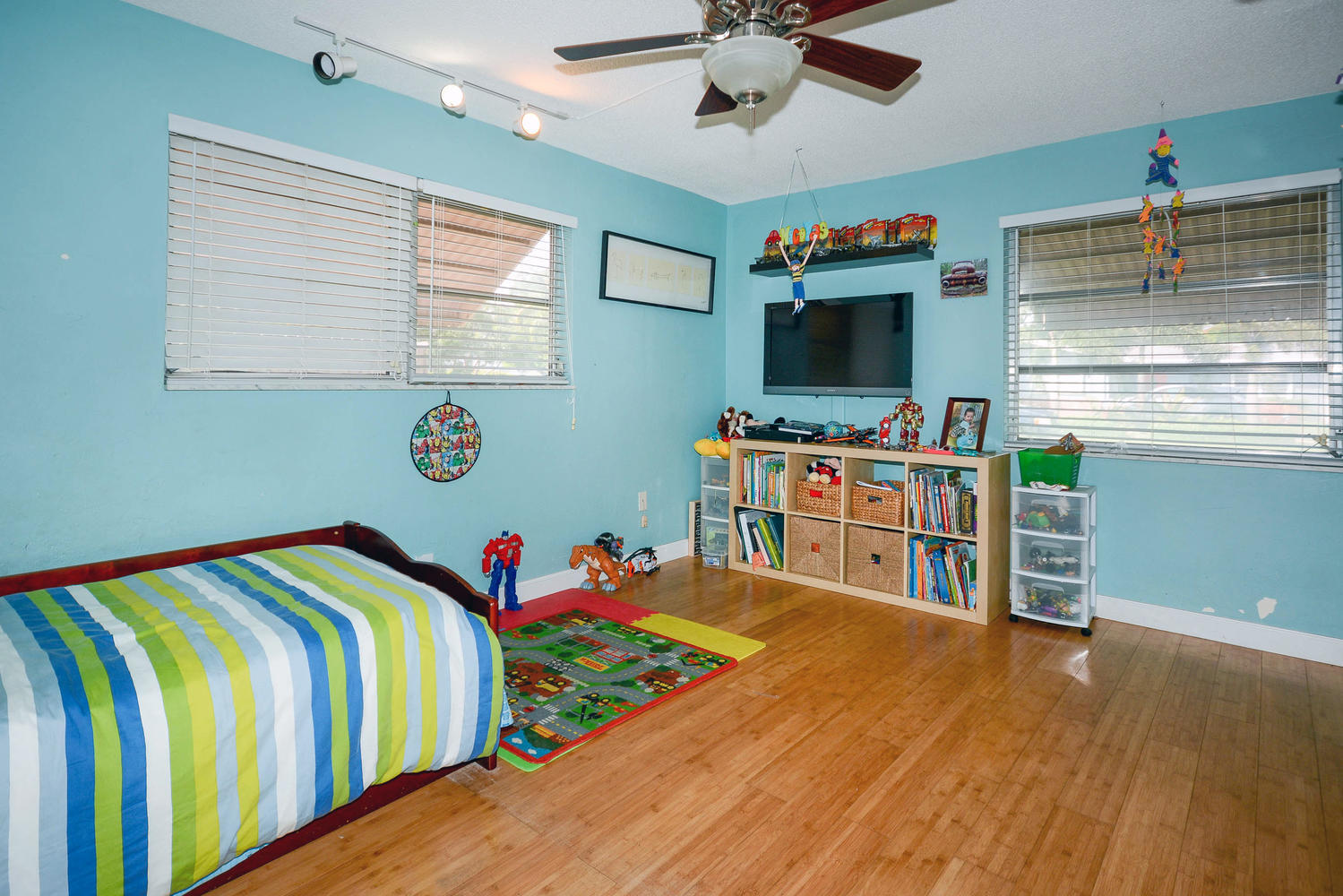 493 Dover Road Tequesta, FL 33469 - Photo 23 of 33 a bedroom with a bed and a flat screen tv