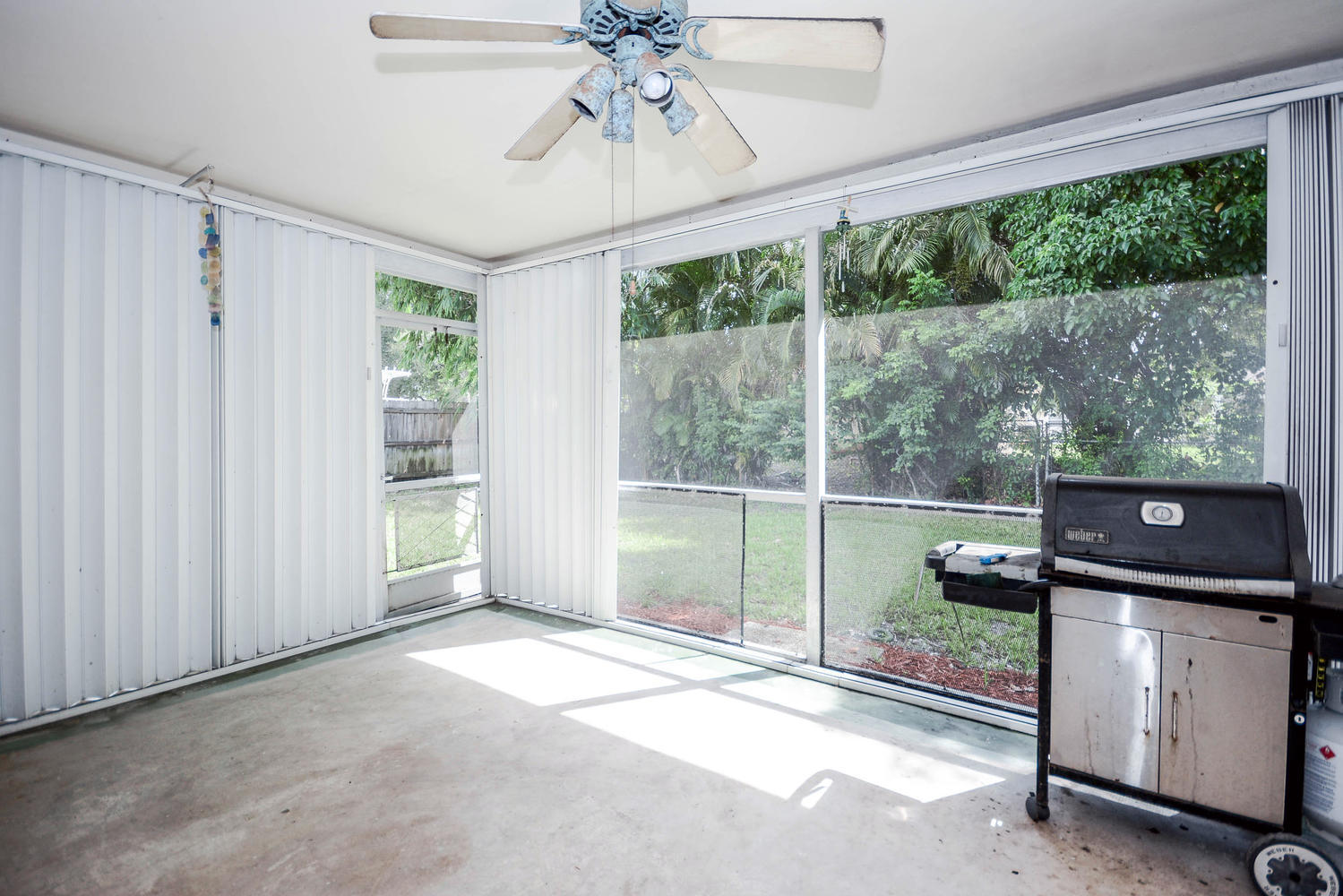 493 Dover Road Tequesta, FL 33469 - Photo 27 of 33 a view of a room with a window and a ceiling fan