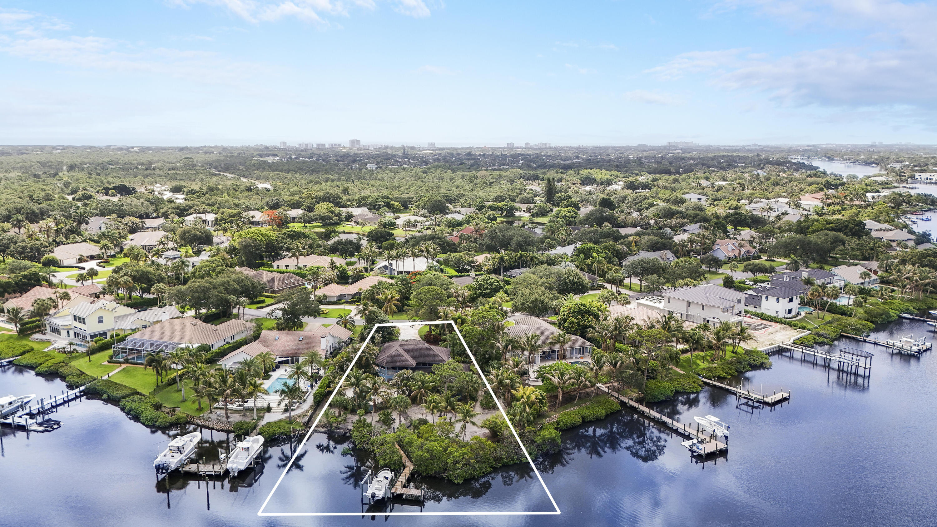 18791 Southeast River Ridge Road Jupiter, FL 33469 - Photo 4 of 25 an aerial view of a city with lots of residential buildings