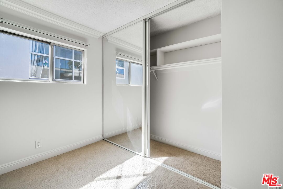 7548 Hampton Avenue, Unit 304 West Hollywood, CA 90046 - Photo 12 of 23 a view of an empty room with a window
