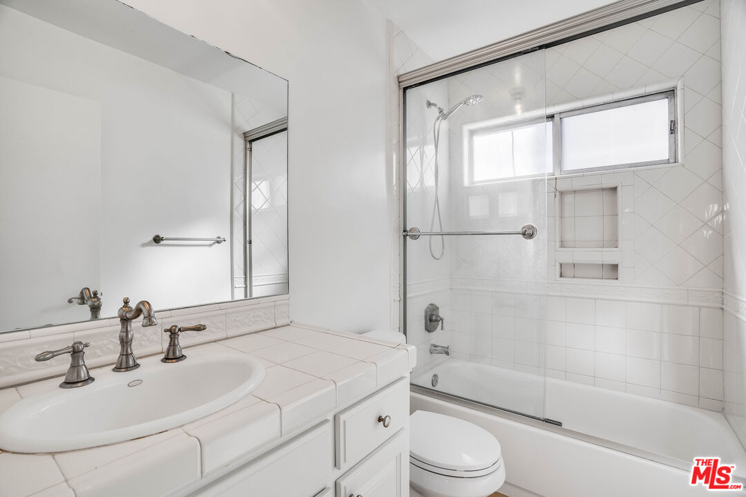 7548 Hampton Avenue, Unit 304 West Hollywood, CA 90046 - Photo 13 of 23 a bathroom with a sink toilet and shower