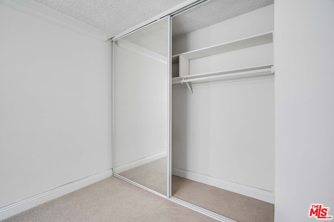7548 Hampton Avenue, Unit 304 West Hollywood, CA 90046 - Photo 16 of 23 a view of an empty walk in closet
