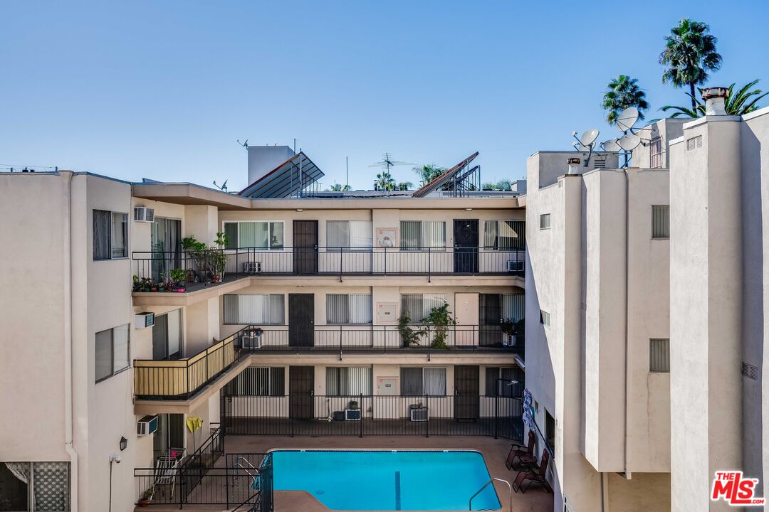 7548 Hampton Avenue, Unit 304 West Hollywood, CA 90046 - Photo 19 of 23 a front view of a house with porch