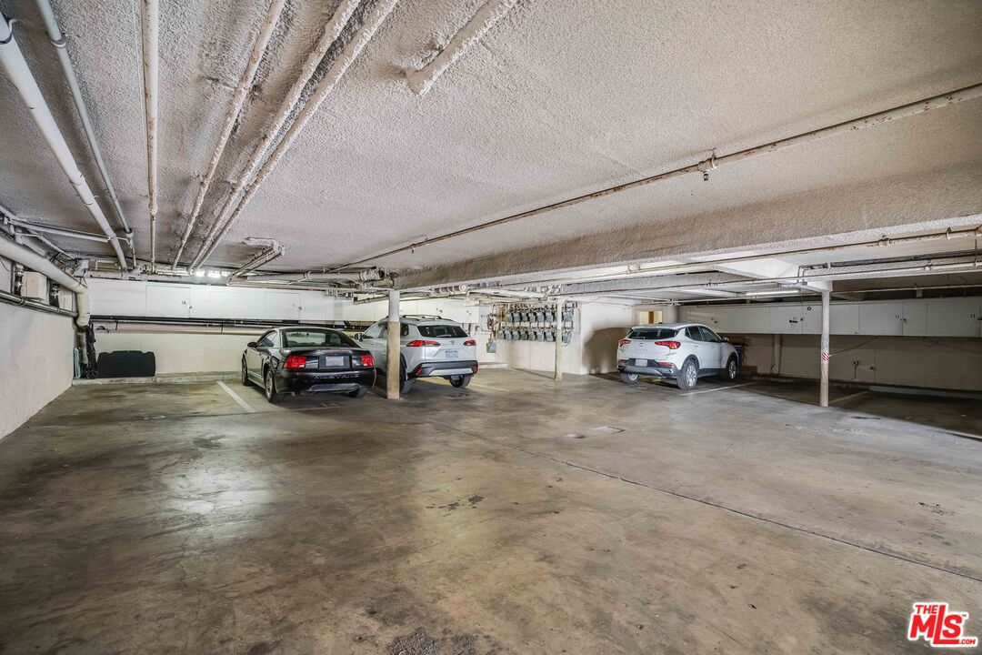 7548 Hampton Avenue, Unit 304 West Hollywood, CA 90046 - Photo 20 of 23 a view of parking garage with cars